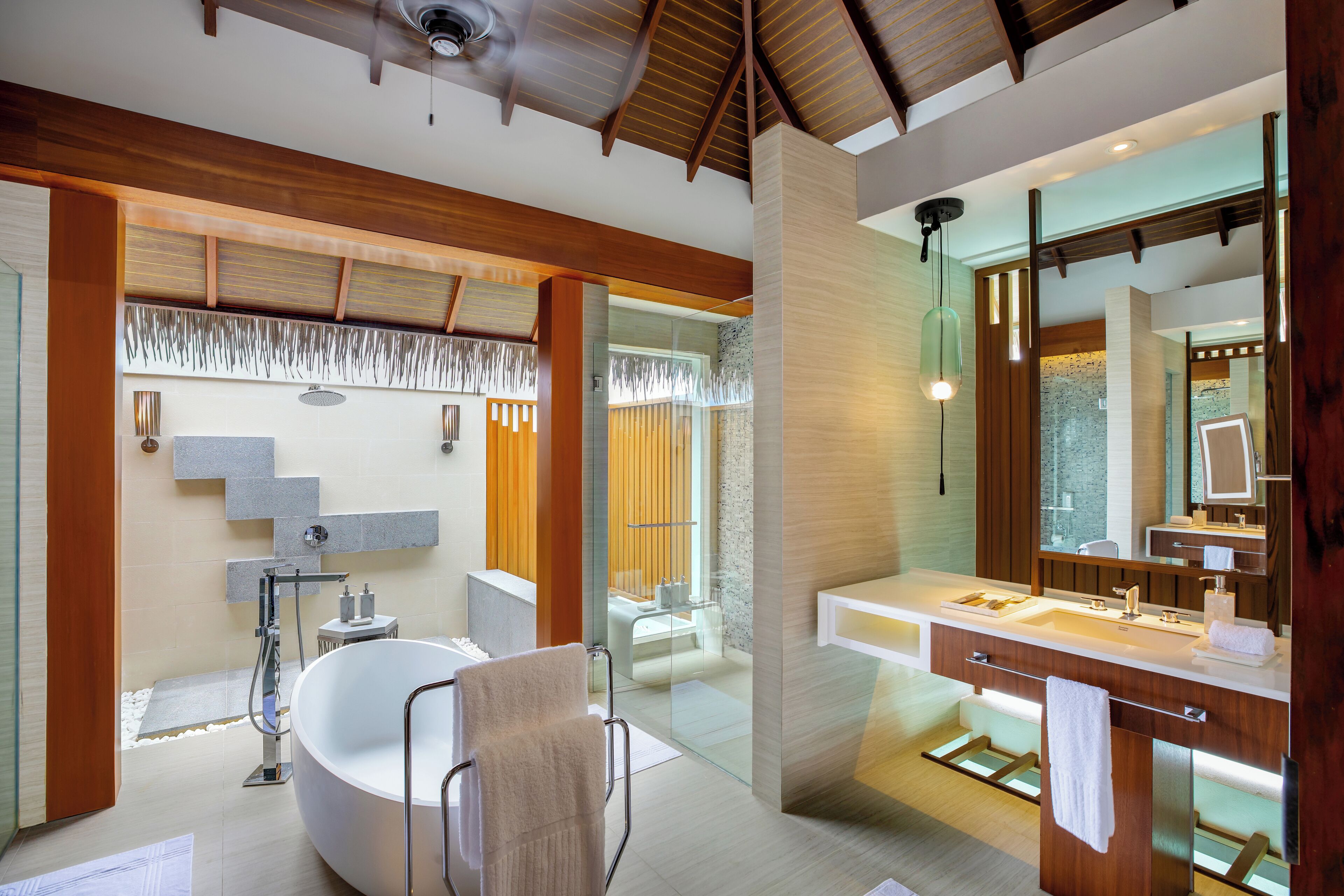 separate bathtub and shower, rainfall showerhead, designer toiletries