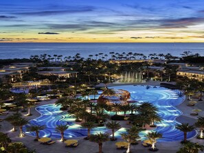 A resort with multiple swimming pools, palm trees, and beachfront views. - Pullman Phu Quoc Beach Resort (Phu Quoc)