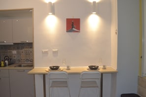 Fridge, microwave, stovetop, coffee/tea maker