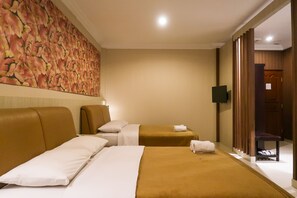 Superior Quadruple Room, 2 Queen Beds, Non Smoking, Garden View | Desk, laptop workspace, blackout drapes, free WiFi