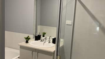 Shower, hair dryer, towels, shampoo