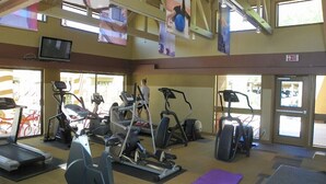 A gym with treadmills, elliptical machines, and stationary bikes. - Charming villa on golf course in Old Town Scottsdale (Scottsdale)