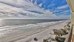 A beach view with a clear sky and ocean. - Wall-to-wall ocean views! Dog friendly! Oceanfront balcony with stunning views. (North Myrtle Beach)