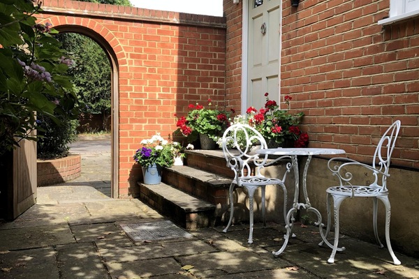 The pretty front door and garden