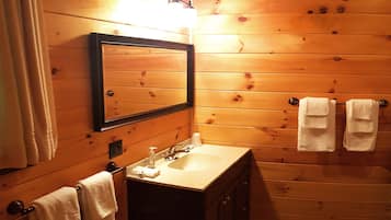 Bathtub, hair dryer, towels, soap