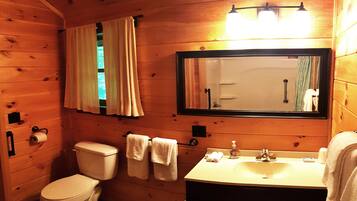 Bathtub, hair dryer, towels, soap