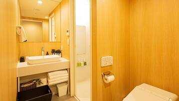 Combined shower/tub, free toiletries, hair dryer, slippers