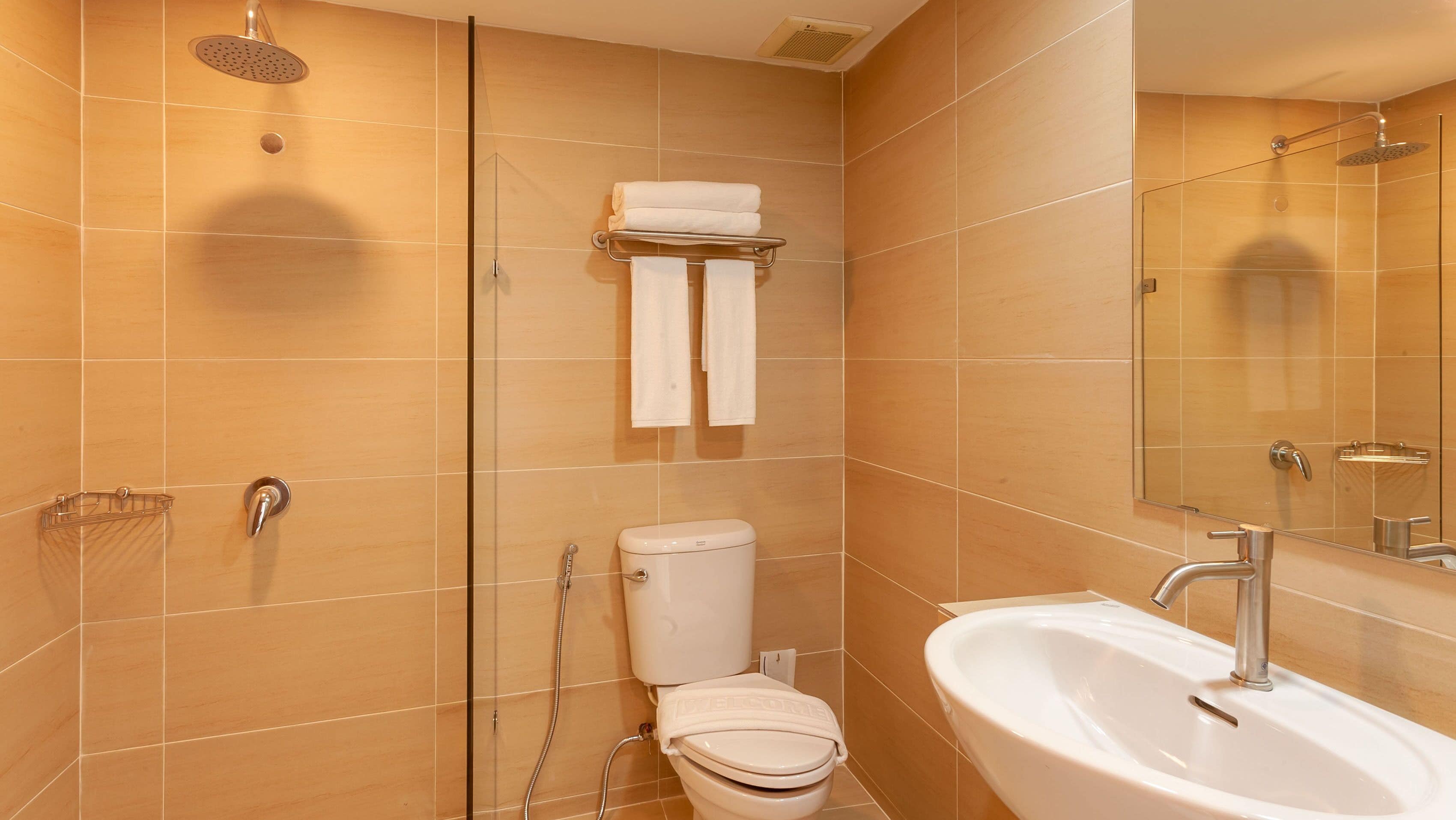 superior room | bathroom | shower, rainfall showerhead, hair dryer, towels