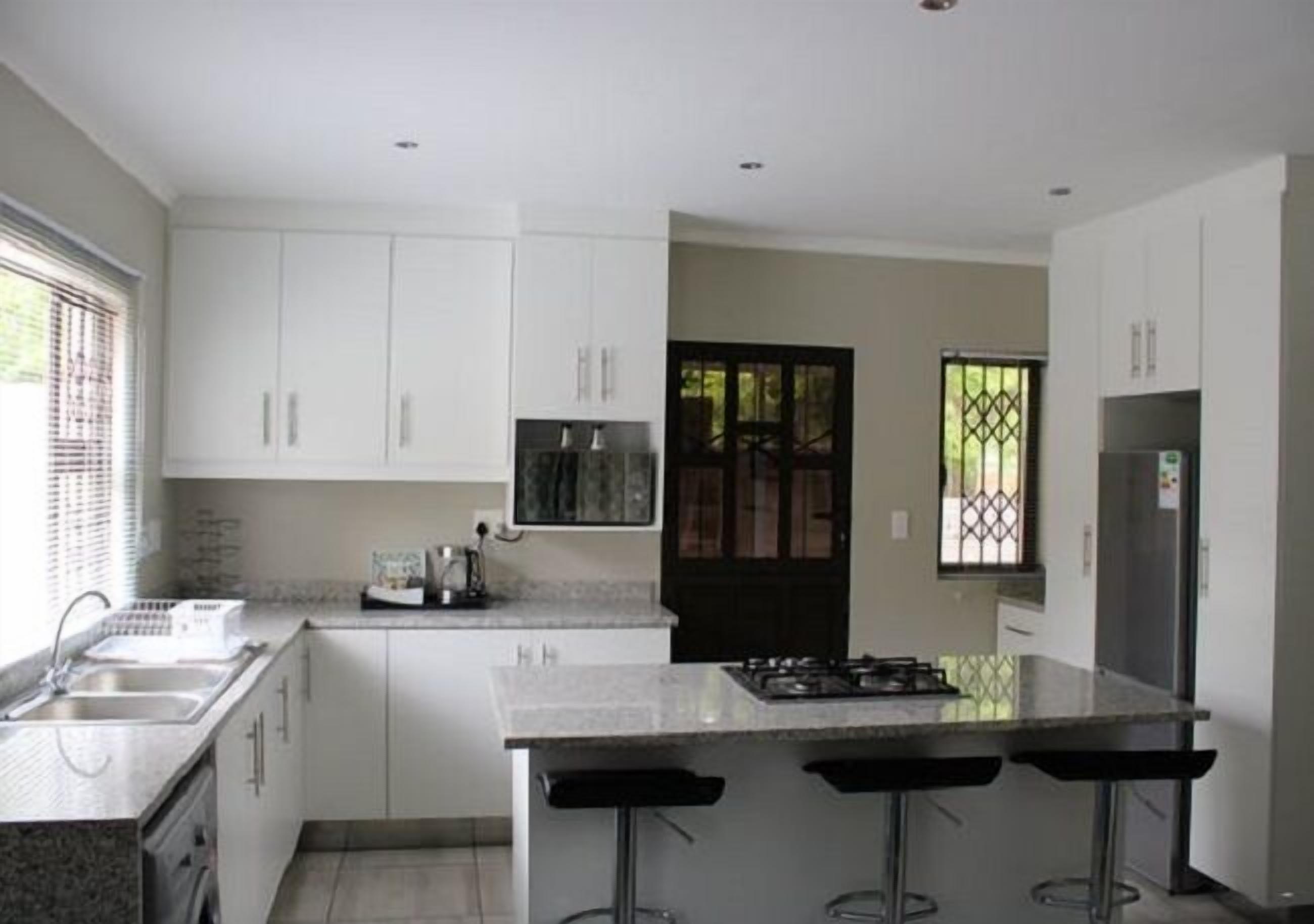 Comfort Apartment | Private kitchen | Full-sized fridge, microwave, oven, electric kettle