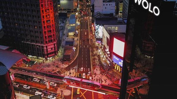 A cityscape at dusk with illuminated buildings and a prominent McDonald's sign. - WOLO Kuala Lumpur (Kuala Lumpur)