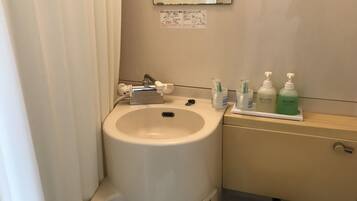 Combined shower/tub, hair dryer, slippers, towels