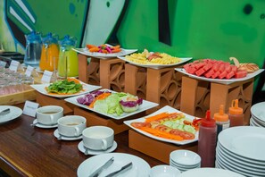 A buffet with various food items and beverages. - VIGU Angkor Hotel (Siem Reap)