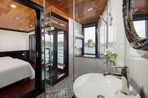 Shower, hair dryer, slippers, towels
