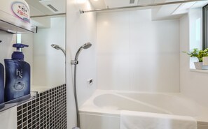 Separate tub and shower, free toiletries, hair dryer, slippers