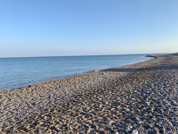 On the beach, sun loungers, beach towels