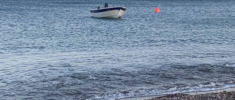 On the beach, sun-loungers, beach towels