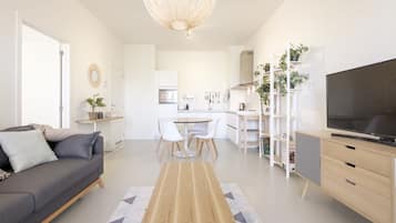 Deluxe Apartment | Living area | 100-cm flat-screen TV with digital channels, TV