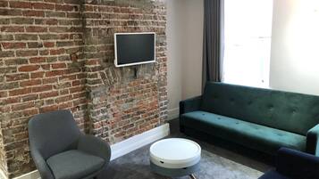 Familie appartement, en-suite badkamer (Street View) | Lounge