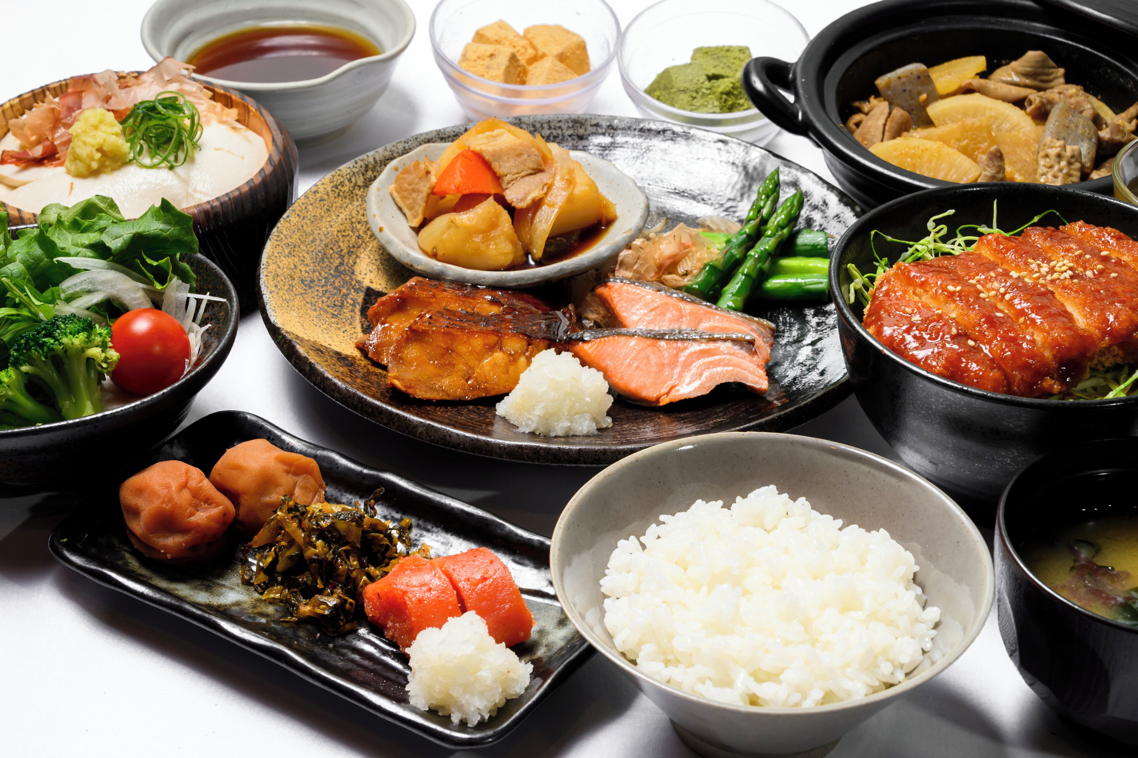 A variety of dishes including rice, vegetables, and meat, suggesting a diverse meal option.