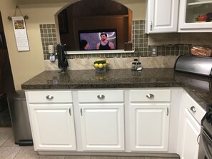 Microwave, dishwasher, coffee/tea maker, cookware/dishes/utensils