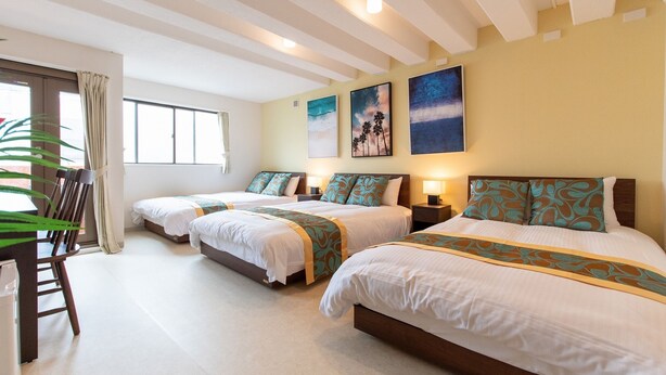 A hotel room with two beds, a large window with curtains, and artwork on the walls. - LUANA Nakano (Tokyo)
