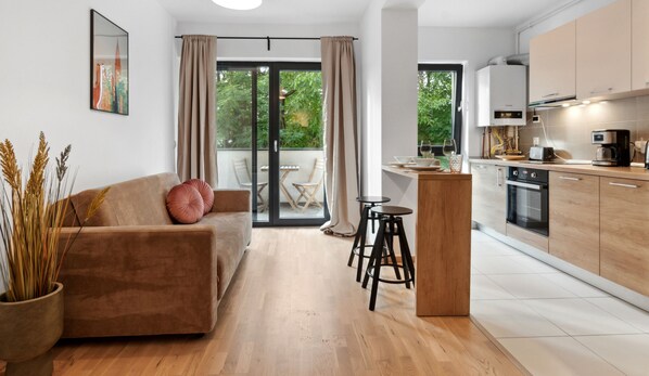 City Apartment | Living area | 80-cm flat-screen TV with digital channels, LCD TV - Maia Apartments (Bucharest)