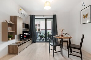 Comfort Apartment | Living area | 80-cm flat-screen TV with digital channels, LCD TV - Maia Apartments (Bucharest)