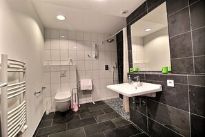 Shower, hair dryer, towels, toilet paper