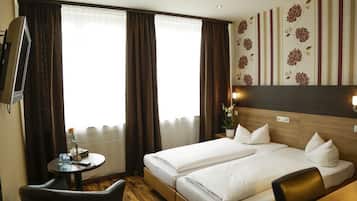 Dubbelrum eller tvÄbÀddsrum | Minibar, skrivbord, mörklÀggningsgardiner och ljudisolering