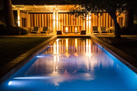 Outdoor pool, open 10:00 AM to 10:00 PM, pool loungers