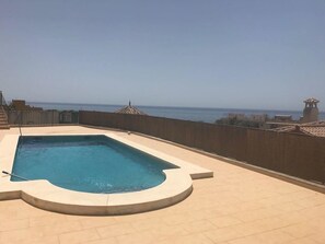 Outdoor pool, pool umbrellas, pool loungers