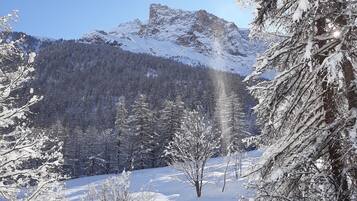 A snowy mountain landscape with a clear sky.