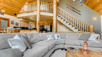 Taulutelevisio, takka, DVD-soitin, pöytätennispöytä