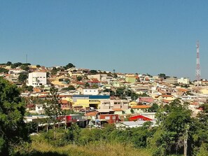 A densely packed urban area with various buildings, including residential and commercial structures. - Hotel Canaã Express (Jarinu)