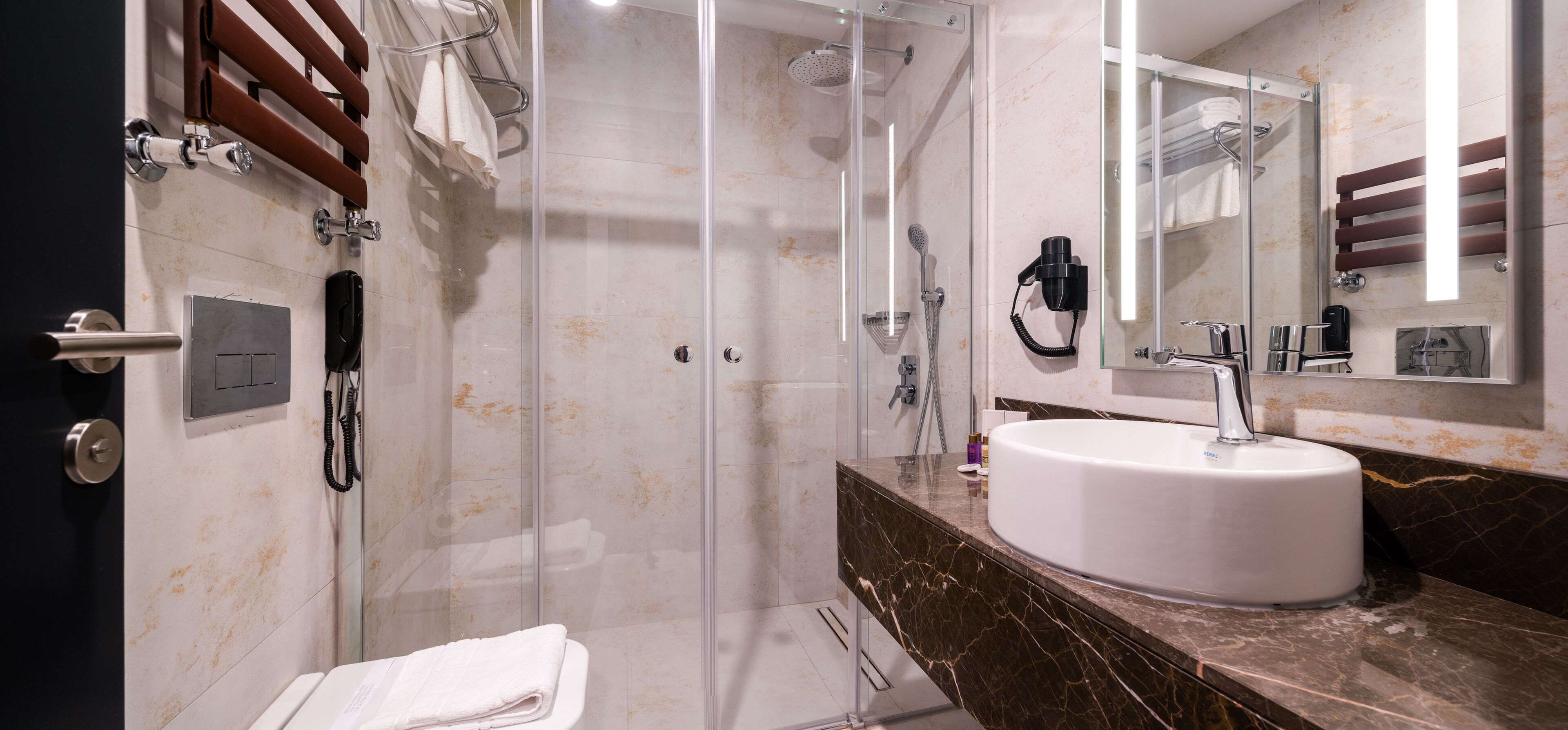 shower, rainfall showerhead, designer toiletries, hair dryer