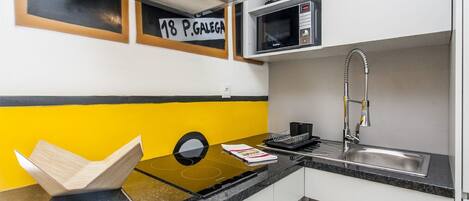 Fridge, microwave, stovetop, coffee/tea maker