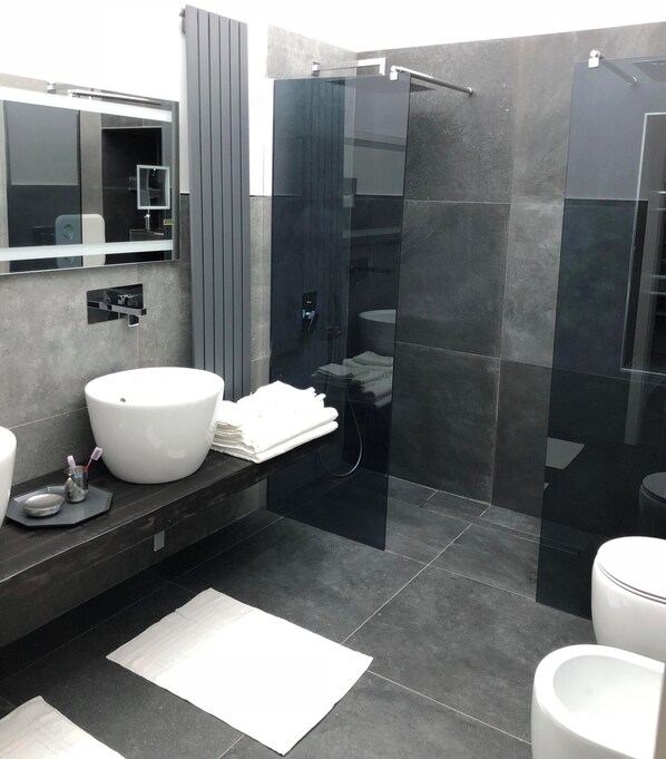 Shower, bidet, towels, soap