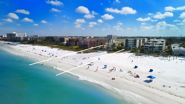Enjoy the beachside views from your balcony overlooking the wide sandy beach and clear waters.