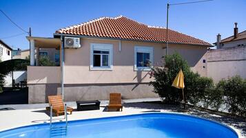A heated pool, pool loungers