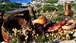 A scenic view of a coastal town with a table displaying local produce and a traditional oil lamp. - Apartment in Barbat with Seaview, Balcony, Air condition, WIFI (3664-3) (Rab)