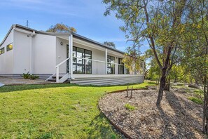 A modern two-story house with a flat roof, large windows, and a covered porch. - Nod Off On Noble (Anglesea)