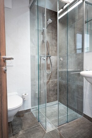 Bathtub, hair dryer, towels, soap