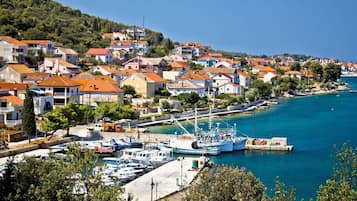 Experience the charm of this coastal town, situated on a hillside with scenic views of the surrounding landscape and sea.