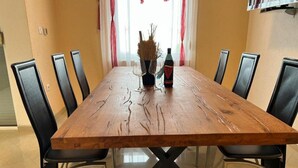 A dining table with chairs, a bottle, and a glass. - Apartment in Zaton (Zadar) with Terrace, Air condition, WIFI, Washing machine (4141-5) (Nin)