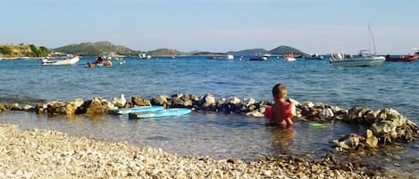 Enjoy a leisurely day by the sea with access to calm waters and a picturesque shoreline.