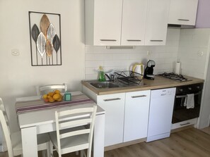 Fridge, microwave, stovetop, coffee/tea maker