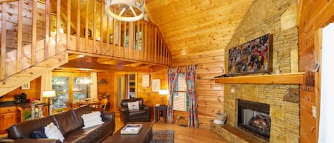 Een televisie, een open haard, een dvd-speler en een tafeltennistafel