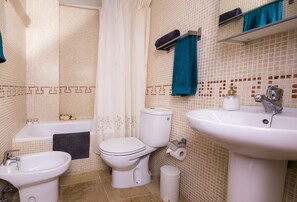 Bathtub, hair dryer, towels
