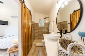 Shower, hair dryer, towels, shampoo