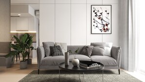A modern living room with a grey sofa, a coffee table, and a large framed artwork on the wall. - Saigon Royal Tower! (Ho Chi Minh)